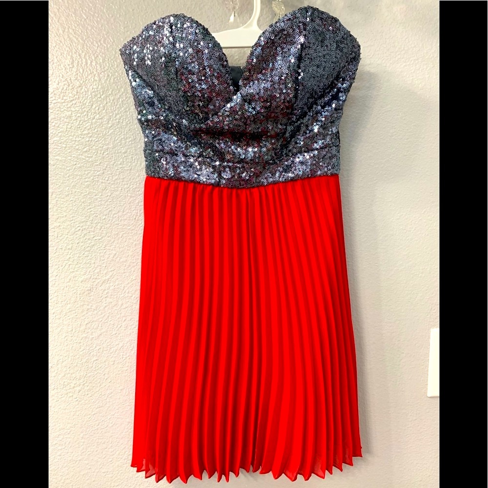 Red & silver strapless sequin pleated mini dress.